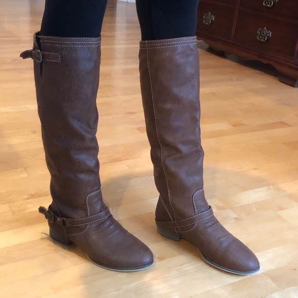 riding boots with red zipper in back